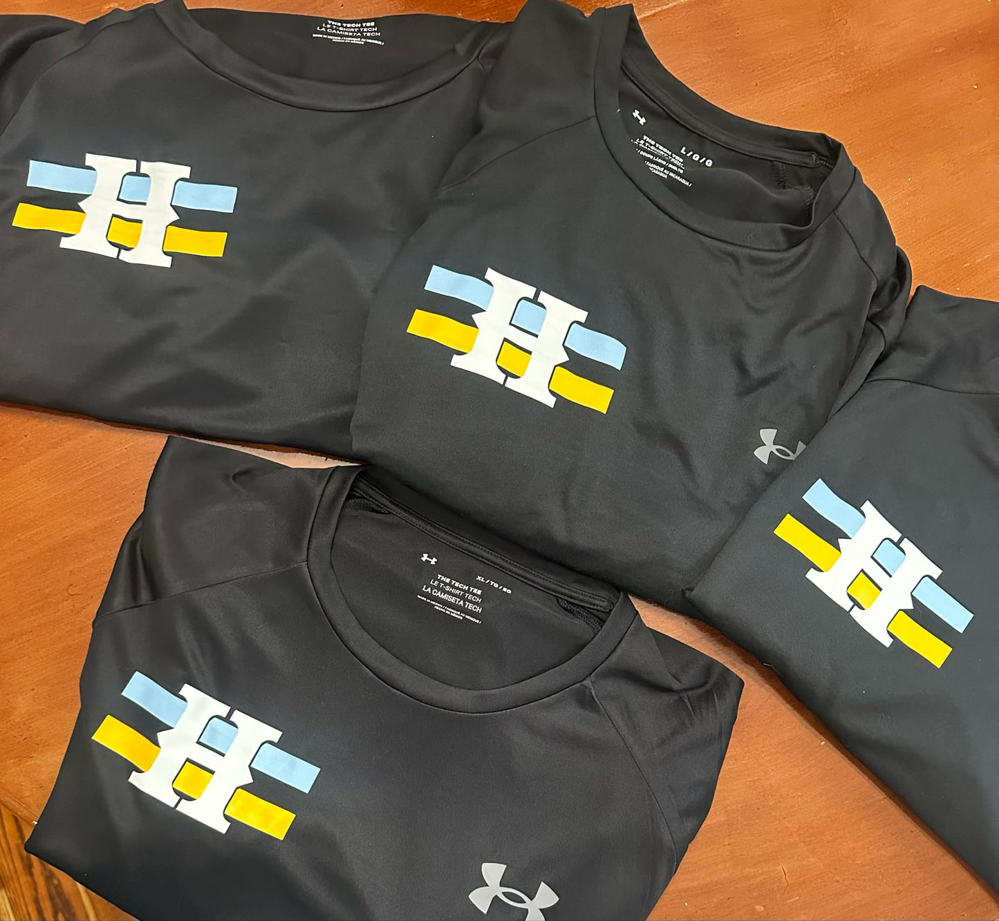 Huskies H with Blue and Yellow Stripe